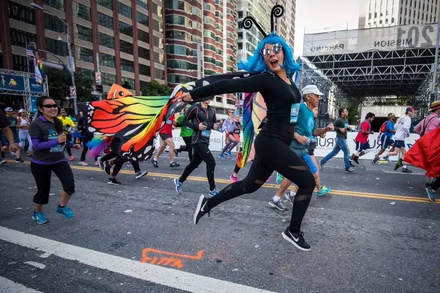 Woman in butterfly costume running Bay to Breakers race 